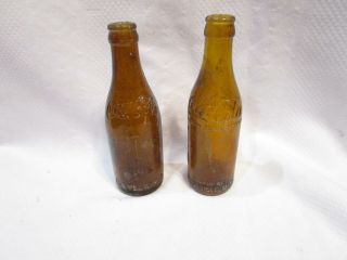 Two Vintage Amber Coca - Cola Bottle Straight Sided Arrow Cleveland Coke Soda
