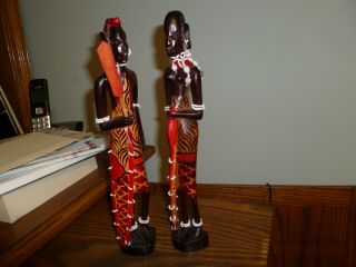 (2) Wood Hand Carved,  Hand Painted African (man - Woman) Figurines.
