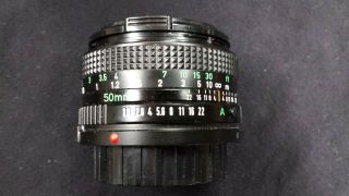 Vintage CANON Camera Lens FD 50mm f 1:1.  8 SLR Made in Japan with a case 2