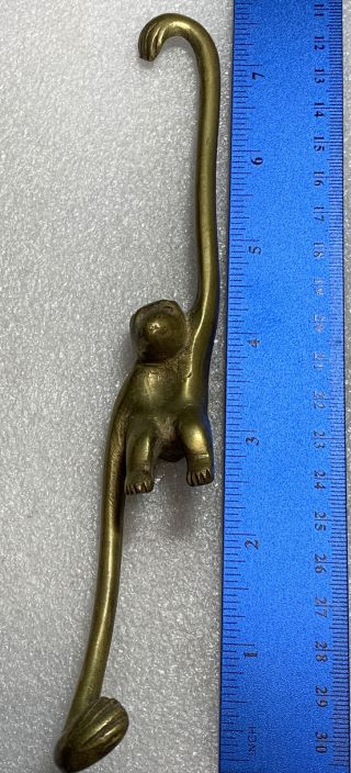 1 Vintage Brass Hanging Monkey,  It’s 7.  5” Inches Tall.  Solid Brass