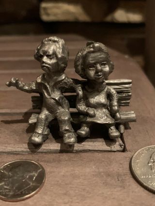 Vintage Pewter Miniature Man & Woman Sitting On Bench