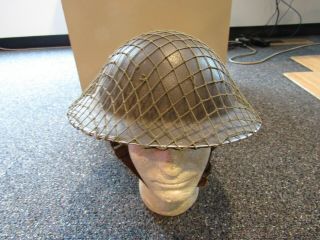 Wwii British 1939 Jcs And W Marked Helmet With Chin Strap,  Liner,  And Camo Net