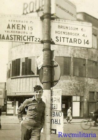 Liberayed Us Army Soldier Posed On Busy Dutch Street By Signposts; 1945