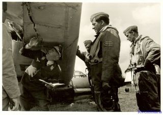 Press Photo: Inspection Luftwaffe Major & Airmen Check Damage On Crashed Bomber