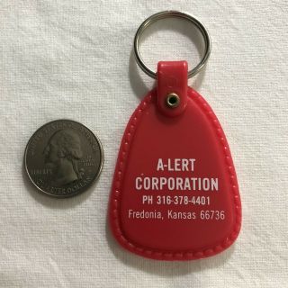 A - Lert Corporation Fredonia Kansas Red Plastic Keychain Key Ring 35955