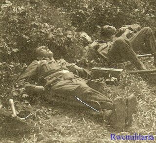 Exhausted Wehrmacht Combat Troops Resting In Field; Grenades In Helmets