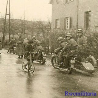 Cute Little Boy On Scooter Passes Wehrmacht Kradmelder W/ Motorcycles On Road