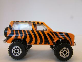 Matchbox Diecast Ford Bronco Ii 1987 Orange Safari Pattern H2