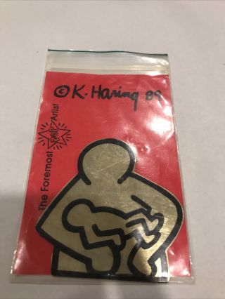 Figure W/ Baby Printed On Brass 1989 By Keith Haring Package