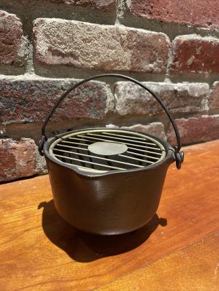 Griswold Cast Iron Wind - Proof 32 Ashtray 3 Legged Pot Style W/ Grate