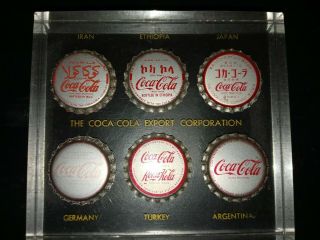 Coca - Cola Export Company Lucite Paperweight With 6 Embedded Foreign Bottle Caps