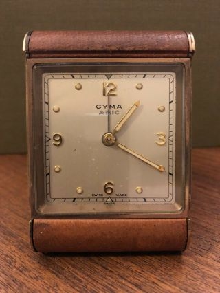 Cyma Amic.  Swiss Made Art Deco Brass Travel Alarm Clock With Brown Leather Case