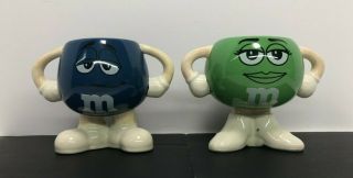 M&m 2 Ceramic Coffee Mugs Arms Legs Double Handle 2009 Blue & Green