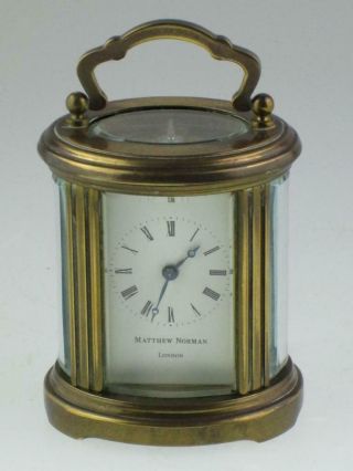 Fine Brass Oval Carriage Clock By Matthew Norman London Swiss Made