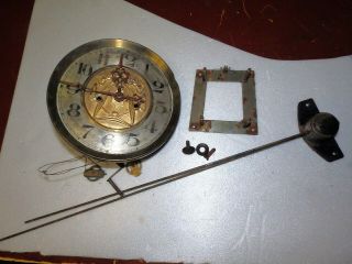 Old Wall Clock With Tone Stuff Wheels And Key In Bad