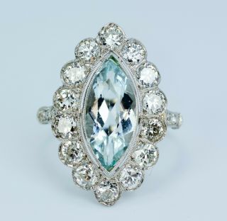 Art Deco Platinum Marquise Blue Aquamarine With A Halo Of Round Diamond Ring