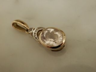 A Stunning 9 Ct Gold Large Oval Gemstone And Diamond Pendant