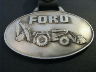 1970 ' s Ford Backhoe Watch Fob Des Moines Iowa Ford Tractor 2620 E.  University 2