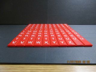 100 RED PLASTIC SCRABBLE LETTER TILES from 2014 SCRABBLE ELECTRONIC SCORING GAME 2