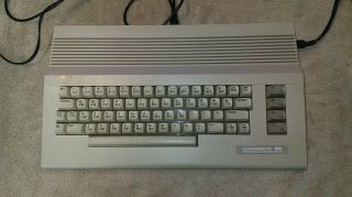 Commodore 64c Computer With Guides