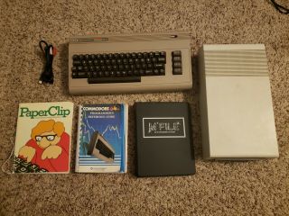 Commodore 64 (includes Vic - 1541 Disk Drive,  Manuals,  And Av Cable)