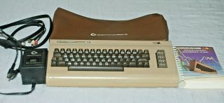 Commodore 64 With Power Cord,  Video Cord,  Dust Cover,  And Instructions