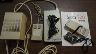 Commodore Amiga A - 500,  PS,  Mouse,  Video Adapter,  external floppy drive,  software 2