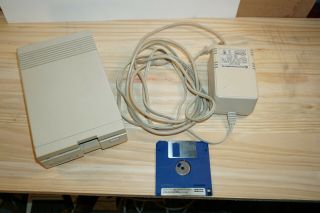 COMMODORE 1581 FLOPPY DISK DRIVE W/ DEMO DISK,  SERIAL CABLE 4