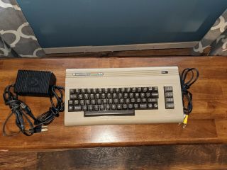 Commodore 64 Computer With Video Cable And Power Supply