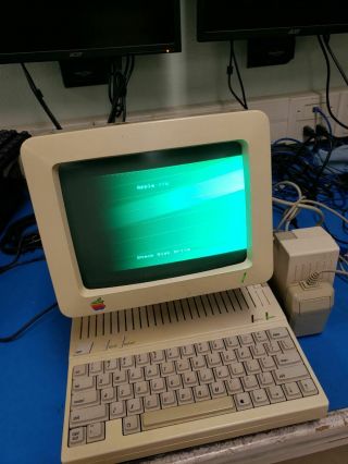 Apple IIc w/ monitor & (4) program diskettes 2