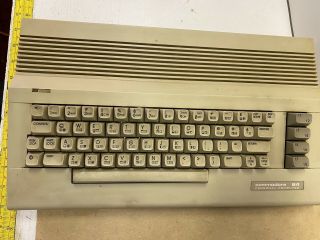 Commodore 64 Personal Computer Keyboard With Wires Powers On