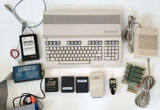 Commodore 128 Computer With Power supply,  games,  cards un - 2