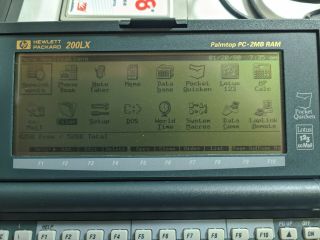 HP 200LX 2MB DOS PDA w/ manuals,  data cable,  128MB PC Card Cond. 2