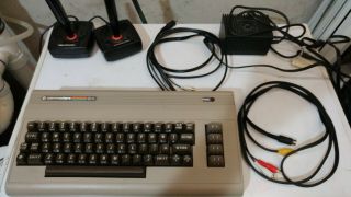 Commodore 64,  Includes Joysticks,  Manuals,  Power And Video Cables