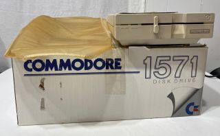 Commodore 1571 Disk Drive W Power Cord,  Cover,  And Box Read Desc