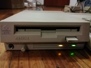 Commodore CD A570 unit in perfect order,  2 CDTV discs 5