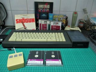 Boxed Amstrad CPC6128 computer (serviced,  belt) games,  mouse,  joystick,  tape 2
