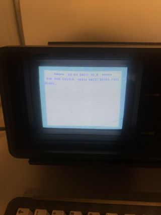 Vintage Commodore SX - 64 portable computer powers on 2