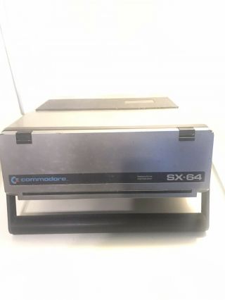 Vintage Commodore SX - 64 portable computer powers on 3