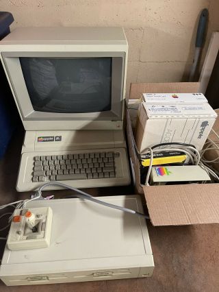 Apple Iie Computer With Monitor,  Base,  Drive,  Discs,  Joystick And Accessories