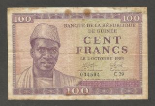 Guinea 100 Francs 2.  10.  1958; Vg; P - 7; L - B202a; Woman,  Child,  Huts,  Palm Trees