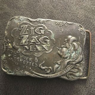 Vintage Zig Zag Man Papier & Cigarettes Belt Buckle With Patina