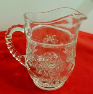 Small Pressed Glass Pitcher With Star & Starburst Pattern Ribbed Handle