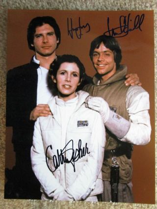 Carrie Fisher Harrison Ford Mark Hamill Star Wars Signed Photo Find 8x10.  5,