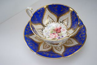 Fine Paragon Cobalt Blue & Gold Feather Tea Cup & Saucer W/berry Flower Center