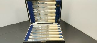 An Antique 12 Piece Silver Plated Cutlery Set By Walker And Hall.  Sheffield.