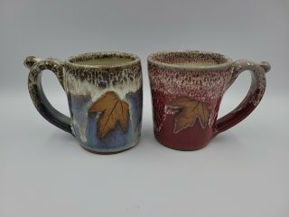 Set Of 2 Alewine Pottery Studio Stoneware Mugs Blue/ Red W/ Maple Leaves - 2011