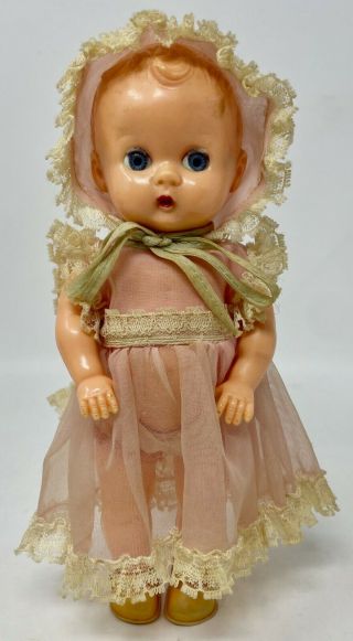 Vintage 8” Celluloid Baby Girl Doll,  Jointed,  Sleepy Blue Eyes,  Clothes