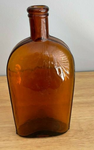 Antique Bright Orange Amber Strap Side Whiskey Flask With X Marking On Base