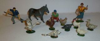 A Group Of Timpo Vintage Lead Farmhands And Animals From The 1940/50s -